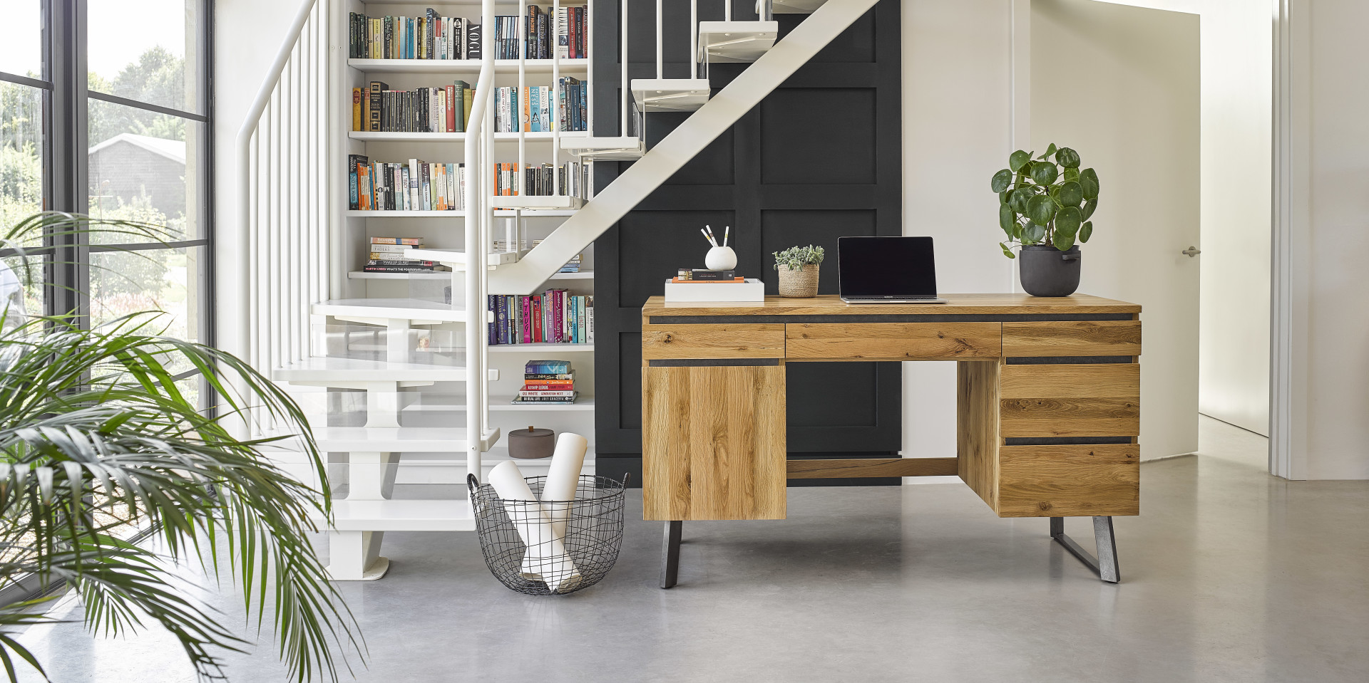 Modern oak desk in bright home office setting