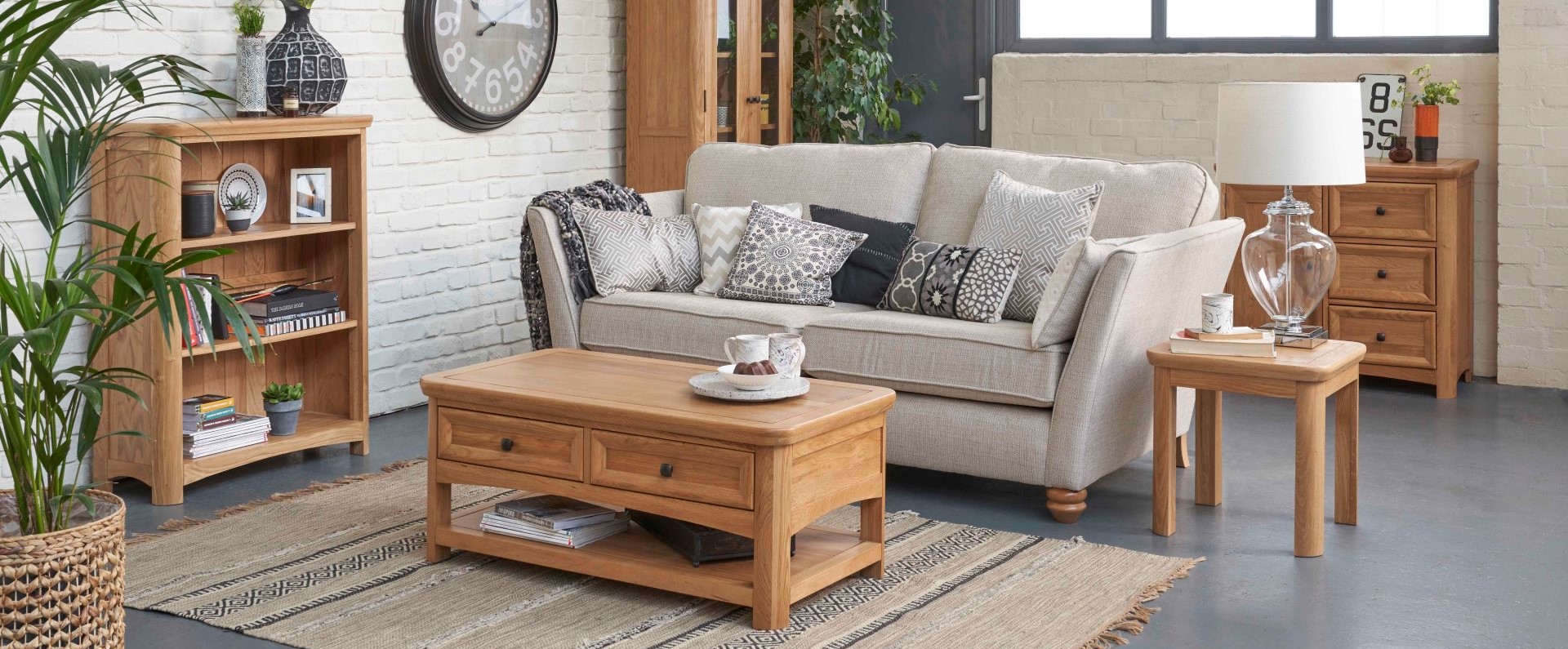 Bright modern living room with pale sofa and oak furniture