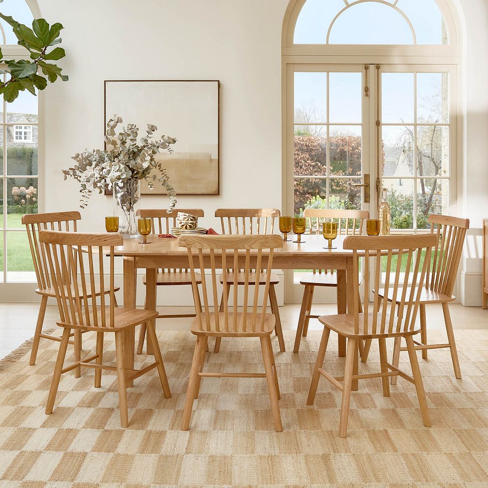 Corton Natural Oak Oval Extending Dining Table 160-200cm + 8 Kingham Natural Oak Spindle Chair 2