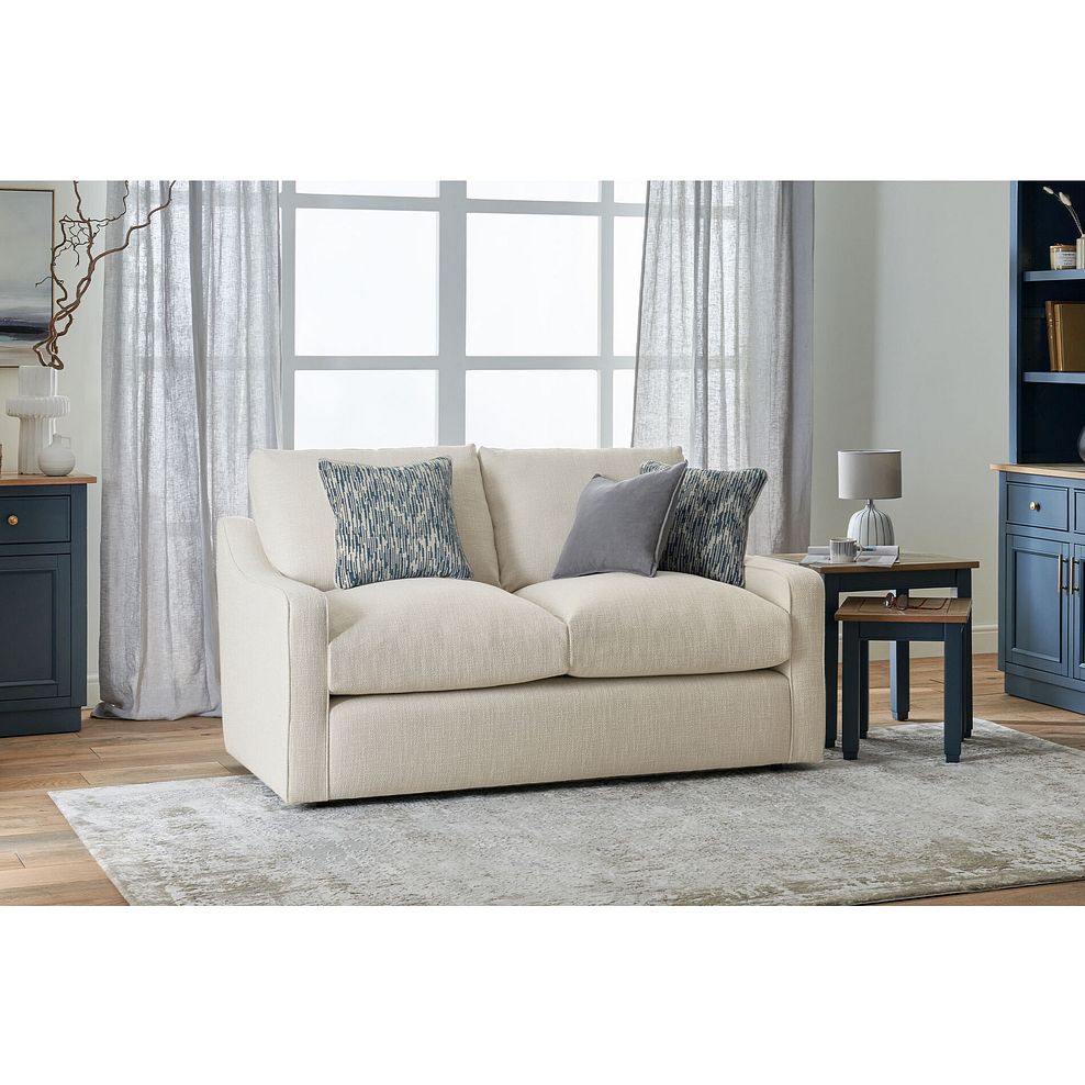 Isabella 2 Seater Sofa in Polly Natural Fabric with Navy Scatter Cushions 1